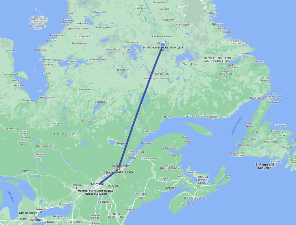 A map of northeastern Canada highlighting a flight path from Schefferville, located in northern Quebec, down to Quebec City. The line marks a direct route between the two locations, passing through parts of Labrador. The map shows geographical details, including nearby cities like Montreal, Ottawa, and towns in Newfoundland and Labrador, Quebec, and other parts of eastern Canada.